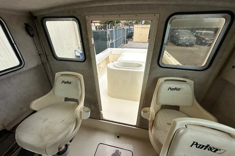 Slide: The Image of Interior of 2003 Parker 2520 Deep Vee Sport Cabin with two Parker-branded seats. - 14