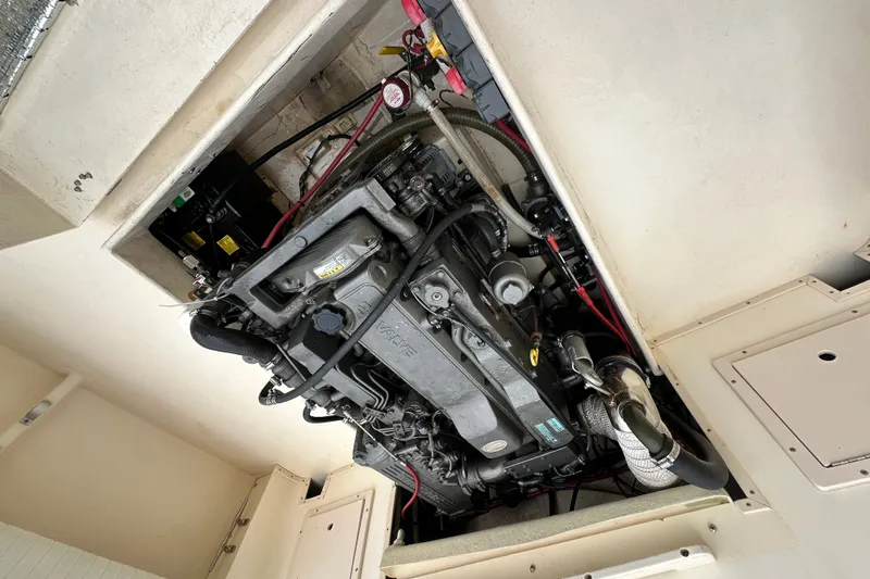 Slide: The Image of Engine compartment of a 2003 Parker 2520 Deep Vee Sport Cabin boat. - 26