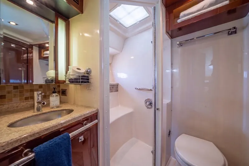 Slide: The Image of Luxurious bathroom in 2008 Sea Ray 47 Sedan Bridge yacht with modern fixtures. - 11