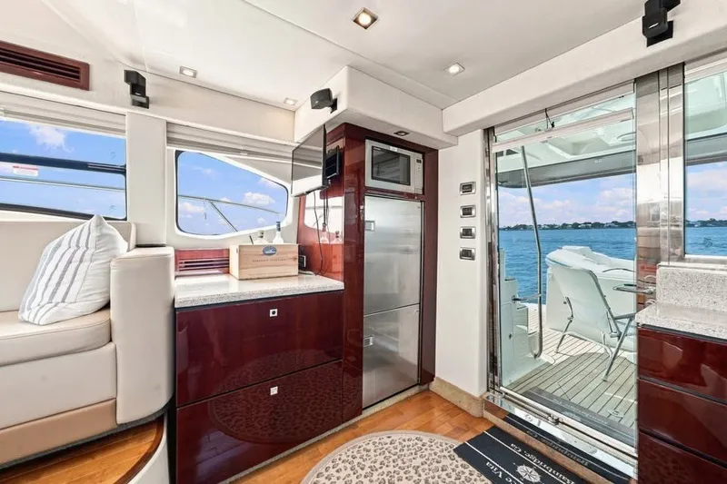 Slide: The Image of Luxurious interior of 2008 Sea Ray 47 Sedan Bridge yacht with ocean view. - 5