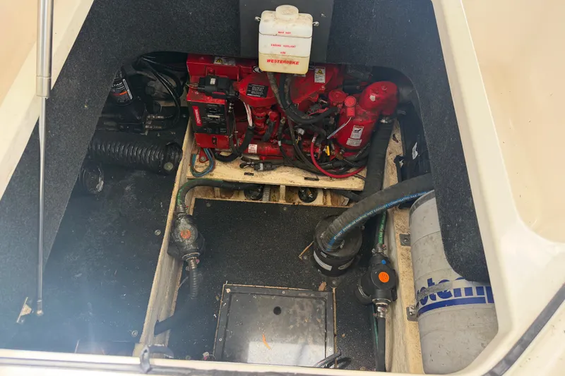 Slide: The Image of Engine compartment of 2023 Regal 26 XO boat, showcasing mechanical components and wiring. - 8