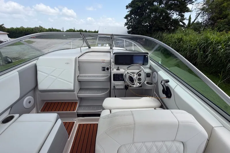 Slide: The Image of 2023 Regal 26 XO boat interior with modern dashboard and seating. - 2