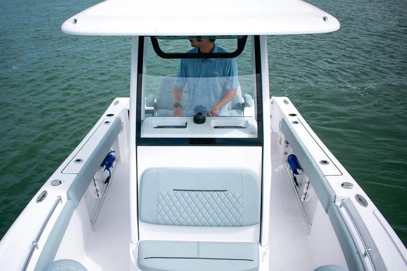 Slide: The Image of 2026 Sportsman Open 212 Center Console boat on water, featuring sleek design and modern controls. - 11