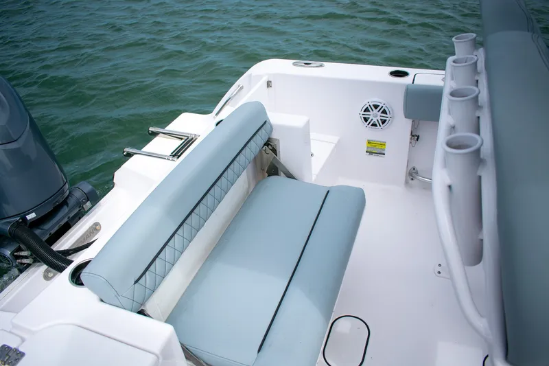 Slide: The Image of 2026 Sportsman Open 212 Center Console boat interior with seating and rod holders. - 15
