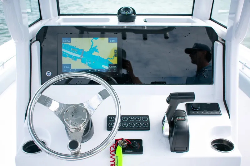 Slide: The Image of 2026 Sportsman Open 212 Center Console dashboard with navigation display and controls. - 18