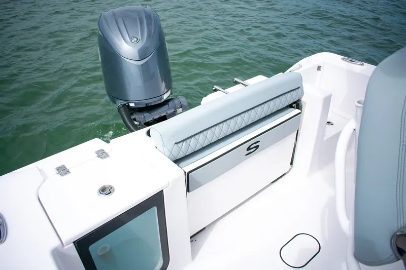 Slide: The Image of 2026 Sportsman Open 212 Center Console boat with outboard motor on water. - 14