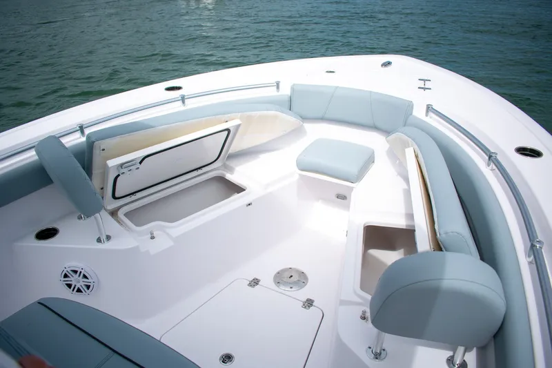 Slide: The Image of 2026 Sportsman Open 212 Center Console boat interior with seating and storage compartments. - 9