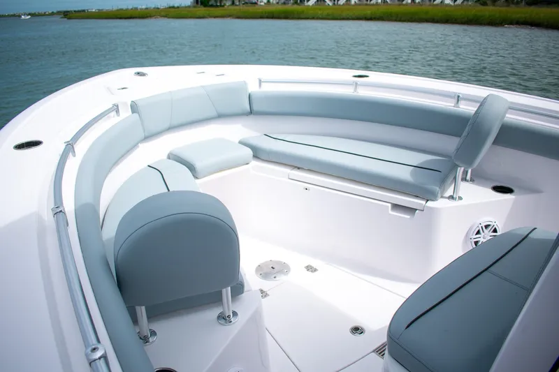 Slide: The Image of 2026 Sportsman Open 212 Center Console boat with spacious seating and sleek design on water. - 8