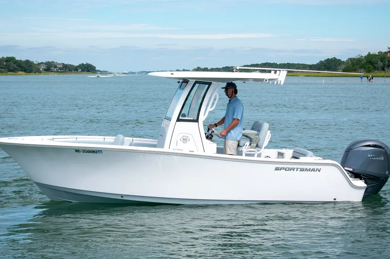 Slide: The Image of 2026 Sportsman Open 212 Center Console boat on calm water, side view. - 4
