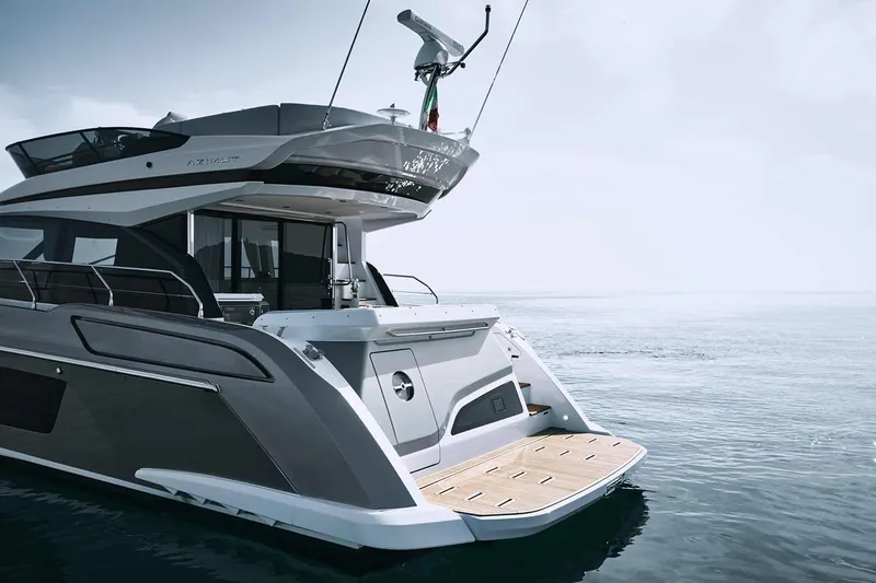 Slide: The Image of Manufacturer Provided Image: 2025 Azimut Fly 53 yacht on calm water, showcasing sleek design and modern features. - 9