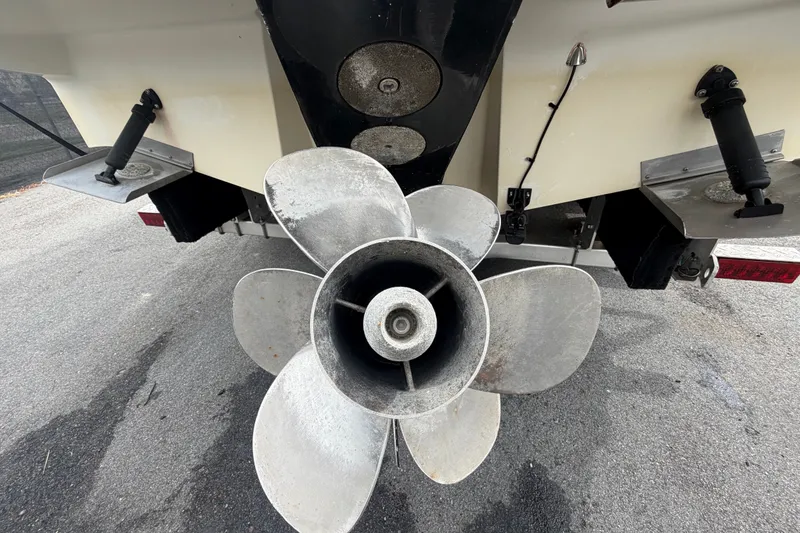Slide: The Image of Rear view of a 2009 Sea Ray 240 Sundancer boat propeller and trim tabs. - 6