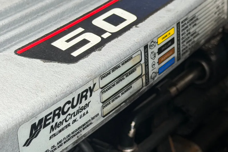 Slide: The Image of Mercury MerCruiser engine label on 2009 Sea Ray 240 Sundancer, featuring 5.0 engine details. - 100