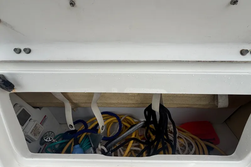Slide: The Image of Storage compartment with ropes and accessories on a boat. - 17