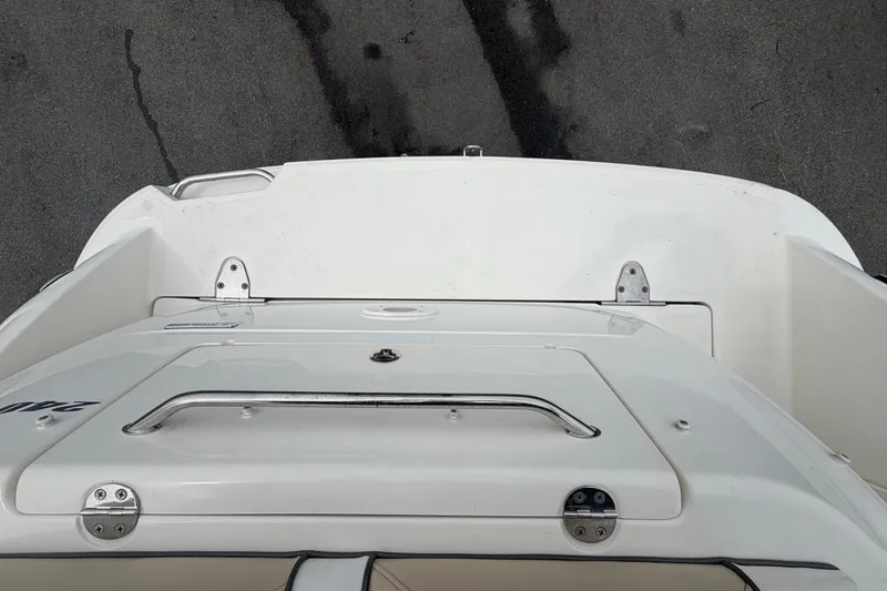 Slide: The Image of Top view of a 2009 Sea Ray 240 Sundancer boat deck with stainless steel handle. - 98