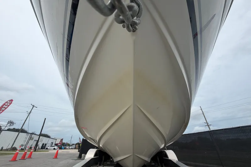 Slide: The Image of 2009 Sea Ray 240 Sundancer boat hull on trailer, viewed from below. - 13