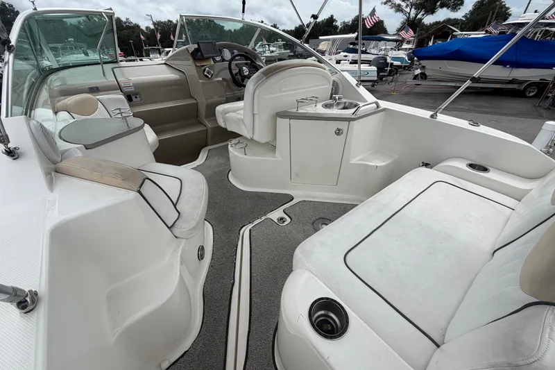 Slide: The Image of Interior view of a 2009 Sea Ray 240 Sundancer boat with seating and steering area. - 19