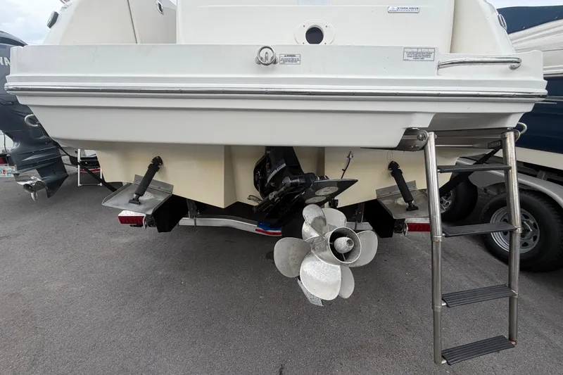 Slide: The Image of Rear view of 2009 Sea Ray 240 Sundancer boat with propeller and ladder. - 3