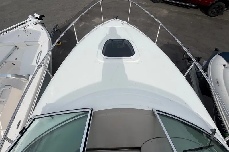 Slide: The Image of Foredeck of a 2009 Sea Ray 240 Sundancer with a hatch and railing. - 17