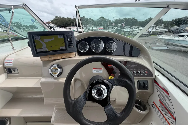 Slide: The Image of Steering console of a 2009 Sea Ray 240 Sundancer with GPS and gauges. - 38