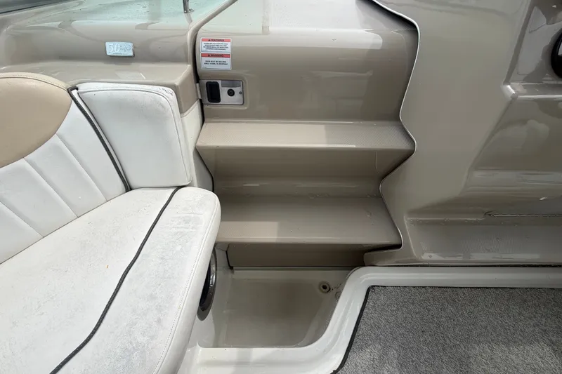 Slide: The Image of Interior seating and steps of a 2009 Sea Ray 240 Sundancer boat. - 54