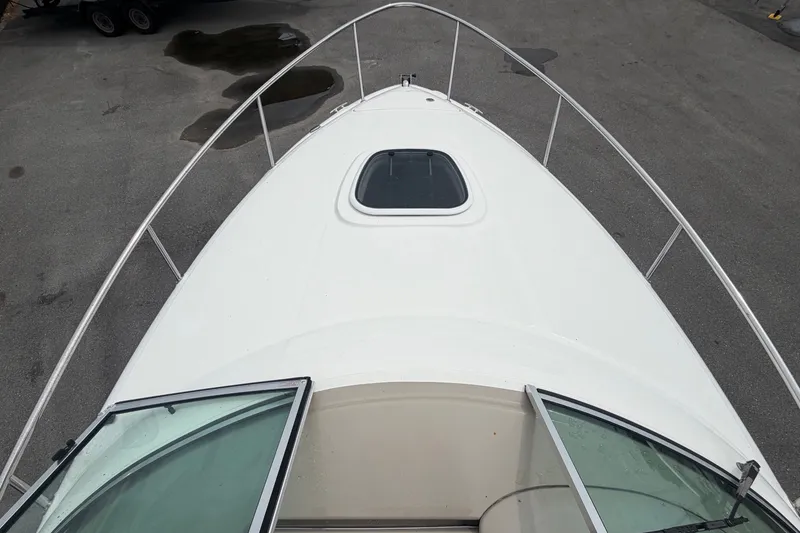 Slide: The Image of Top view of a 2009 Sea Ray 240 Sundancer deck with an open hatch. - 45