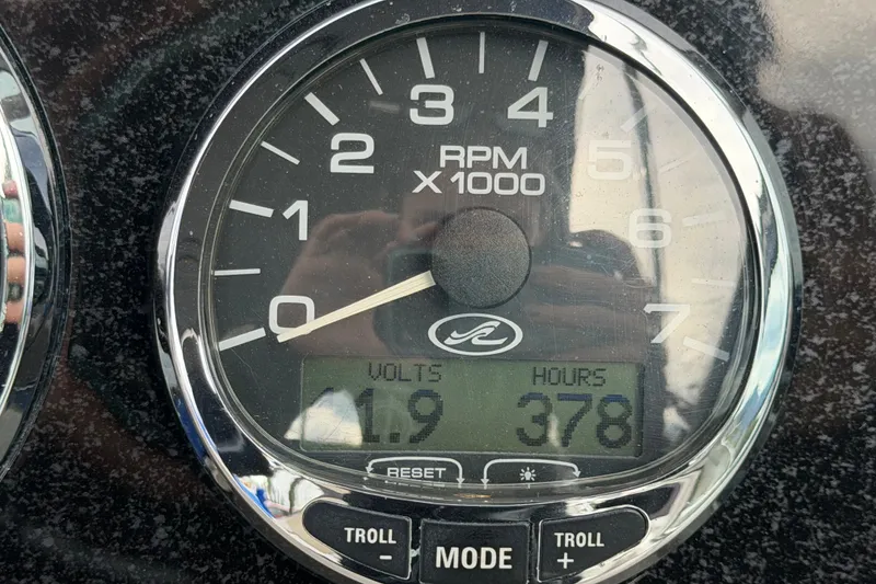Slide: The Image of Close-up of a 2009 Sea Ray 240 Sundancer tachometer showing RPM, volts, and hours. - 14