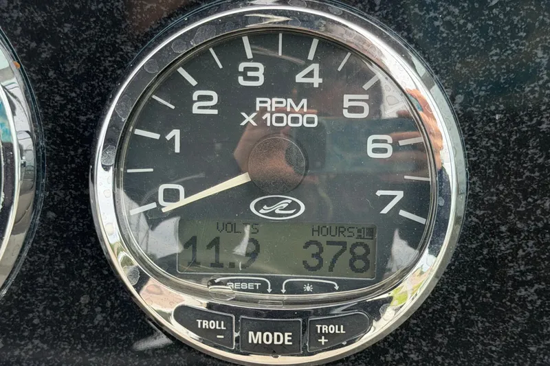 Slide: The Image of Close-up of a 2009 Sea Ray 240 Sundancer tachometer showing 378 hours and 11.9 volts. - 41