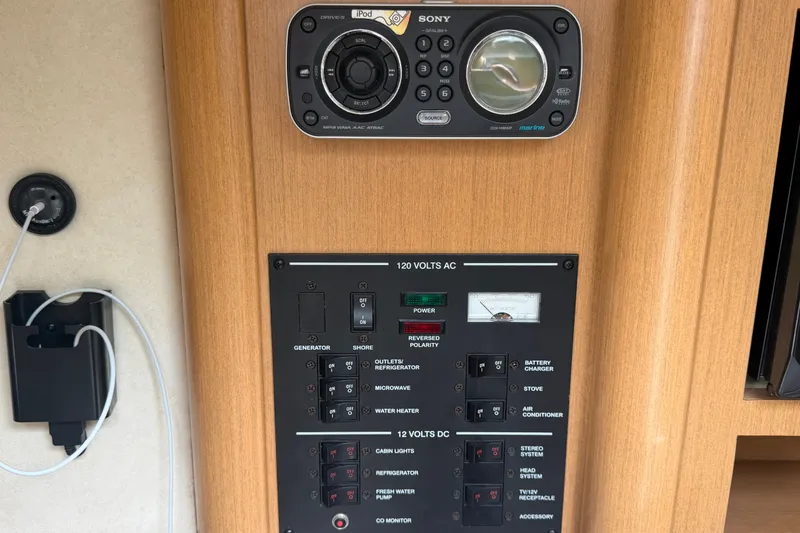 Slide: The Image of Control panel and Sony stereo system on a 2009 Sea Ray 240 Sundancer boat. - 62