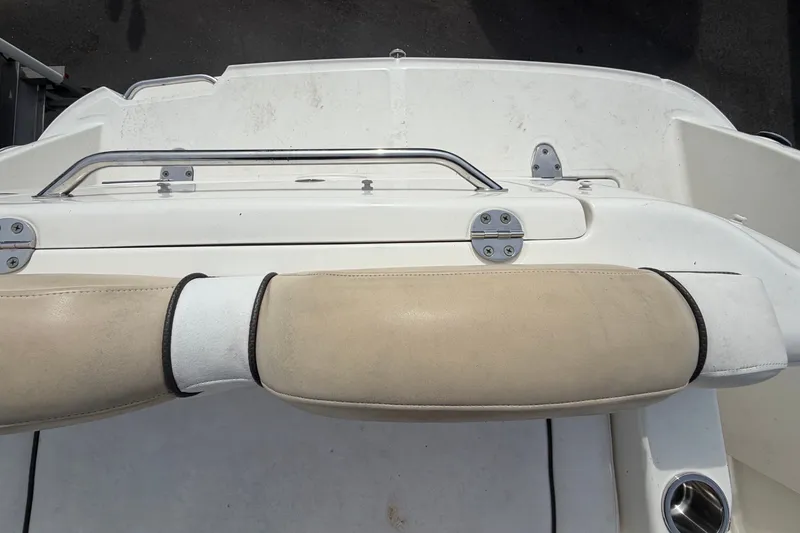 Slide: The Image of Rear view of a 2009 Sea Ray 240 Sundancer with beige upholstery and stainless steel handle. - 28