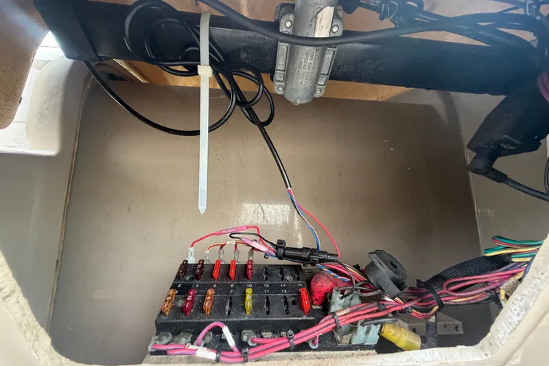 Slide: The Image of Electrical wiring and fuse box inside a 2009 Sea Ray 240 Sundancer boat. - 35