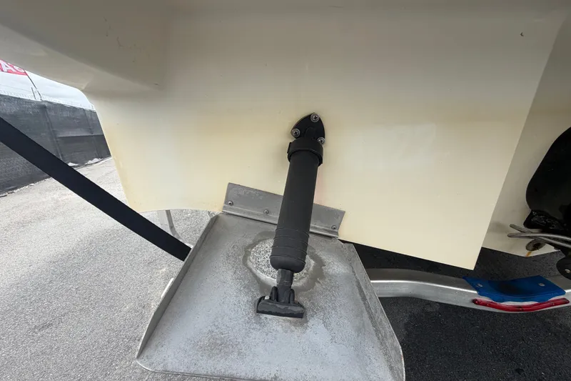 Slide: The Image of Close-up of a 2009 Sea Ray 240 Sundancer boat's trim tab and hydraulic actuator. - 8
