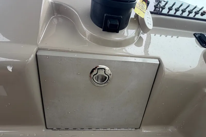 Slide: The Image of Close-up of a storage compartment on a 2009 Sea Ray 240 Sundancer boat. - 34