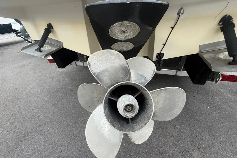 Slide: The Image of Rear view of a 2009 Sea Ray 240 Sundancer boat propeller and trim tabs. - 4