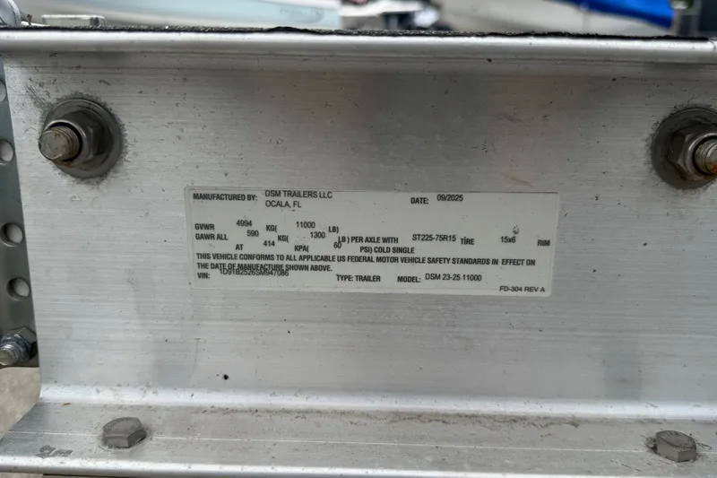Slide: The Image of Label on DSM Trailers LLC, Ocala, FL, with specifications and manufacturing date. - 102