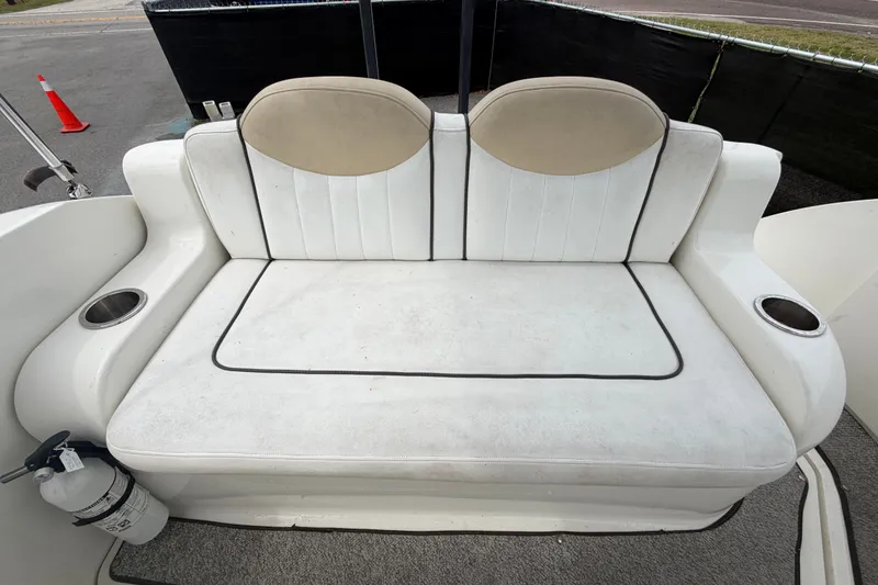 Slide: The Image of Rear seating area of a 2009 Sea Ray 240 Sundancer boat with cup holders. - 96
