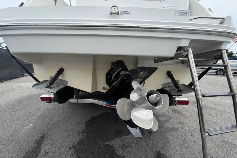Slide: The Image of Rear view of 2009 Sea Ray 240 Sundancer boat with propeller and ladder. - 5