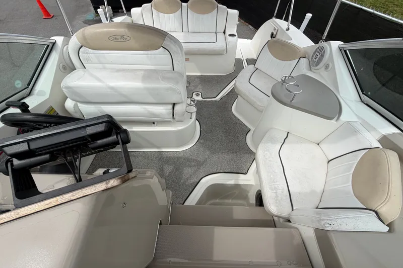 Slide: The Image of Interior view of a 2009 Sea Ray 240 Sundancer boat with seating and helm. - 53