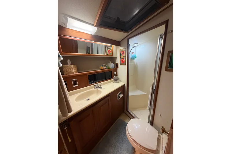 Slide: The Image of Bathroom interior of 1986 Viking 48 Motor Yacht with shower and vanity. - 33