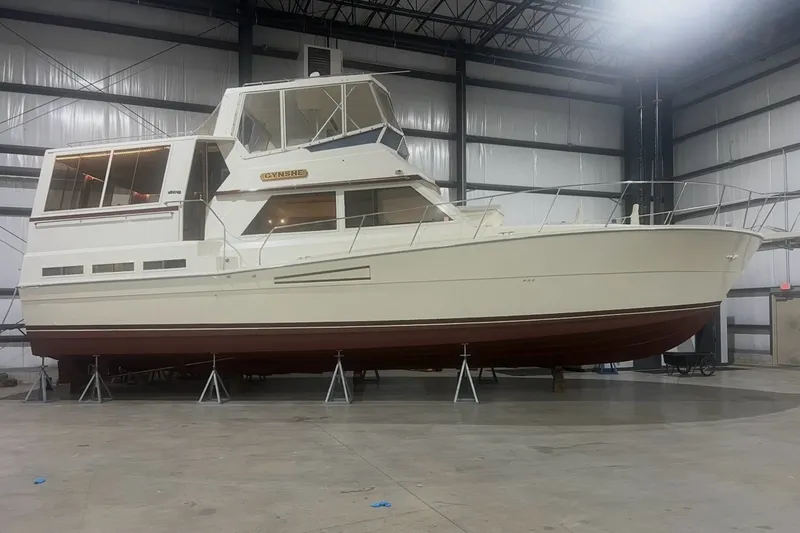 Slide: The Image of 1986 Viking 48 Motor Yacht in indoor storage, elevated on stands. - 3
