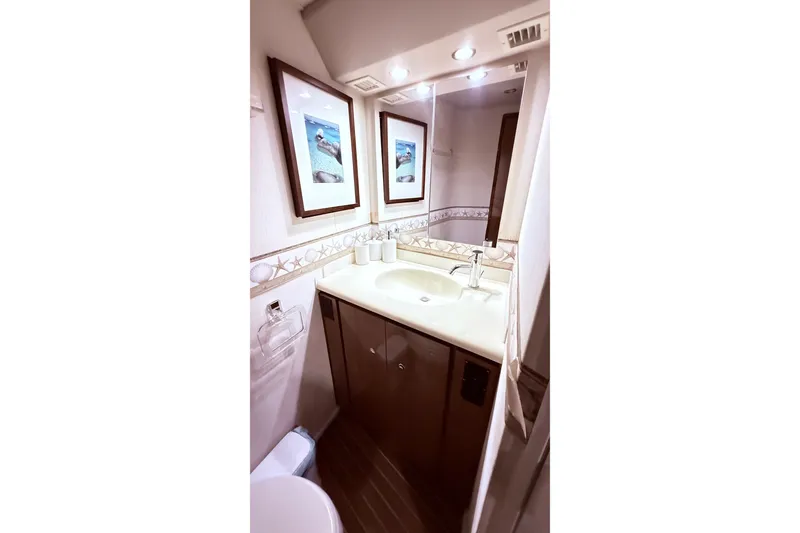 Slide: The Image of Luxurious bathroom interior of 2002 Viking 52 Convertible yacht with elegant decor. - 47
