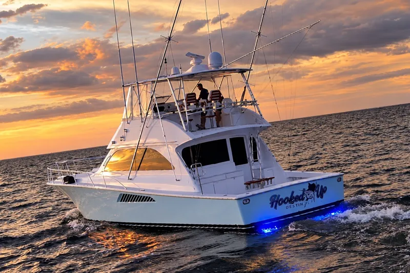 Slide: The Image of 2002 Viking 52 Convertible yacht cruising at sunset on the ocean. - 22