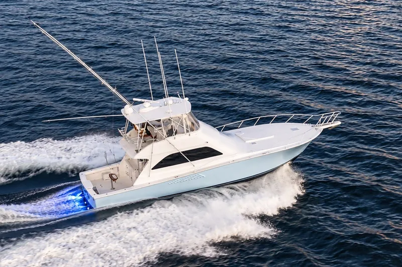 Slide: The Image of 2002 Viking 52 Convertible yacht cruising on open water. - 7