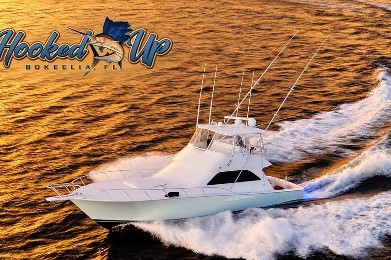 Slide: The Image of 2002 Viking 52 Convertible yacht cruising at sunset near Bokeelia, FL. - 0