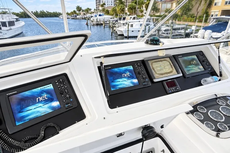 Slide: The Image of Cockpit of 2002 Viking 52 Convertible yacht with navigation screens and controls. - 32