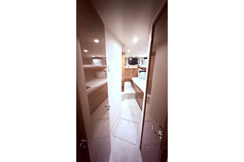 Slide: The Image of Interior view of 2002 Viking 52 Convertible yacht, featuring cozy cabin and modern amenities. - 52