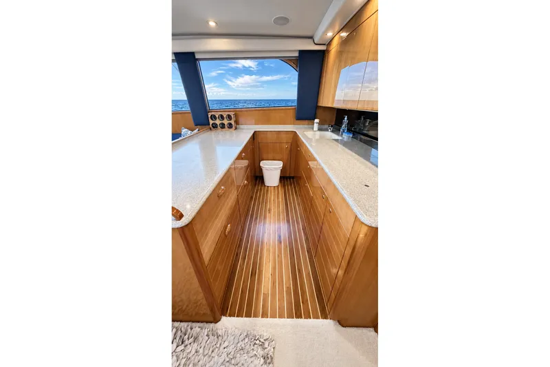 Slide: The Image of Luxurious kitchen interior of 2002 Viking 52 Convertible yacht with ocean view. - 34