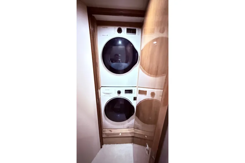 Slide: The Image of Stacked washer and dryer in 2002 Viking 52 Convertible yacht interior. - 39