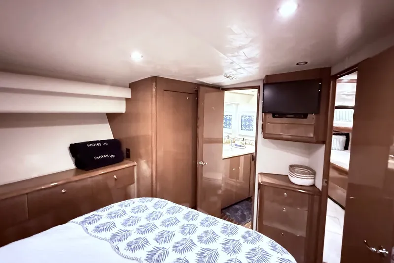 Slide: The Image of Luxurious interior of 2002 Viking 52 Convertible yacht with modern amenities and elegant design. - 44