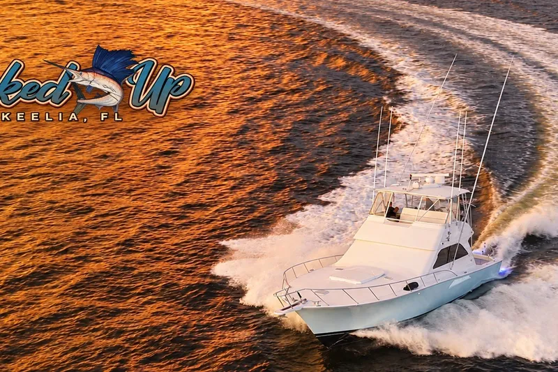 Slide: The Image of 2002 Viking 52 Convertible yacht cruising at sunset near Keelia, FL. - 19