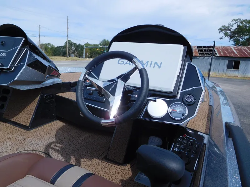 Slide: The Image of The image shows the cockpit of a 2027 Vexus VXs21 boat with a Garmin navigation system. - 14